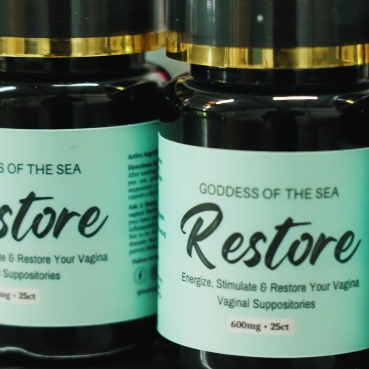 A close-up picture of Goddess of the Sea Restore, boric suppositories, in a green bottle.